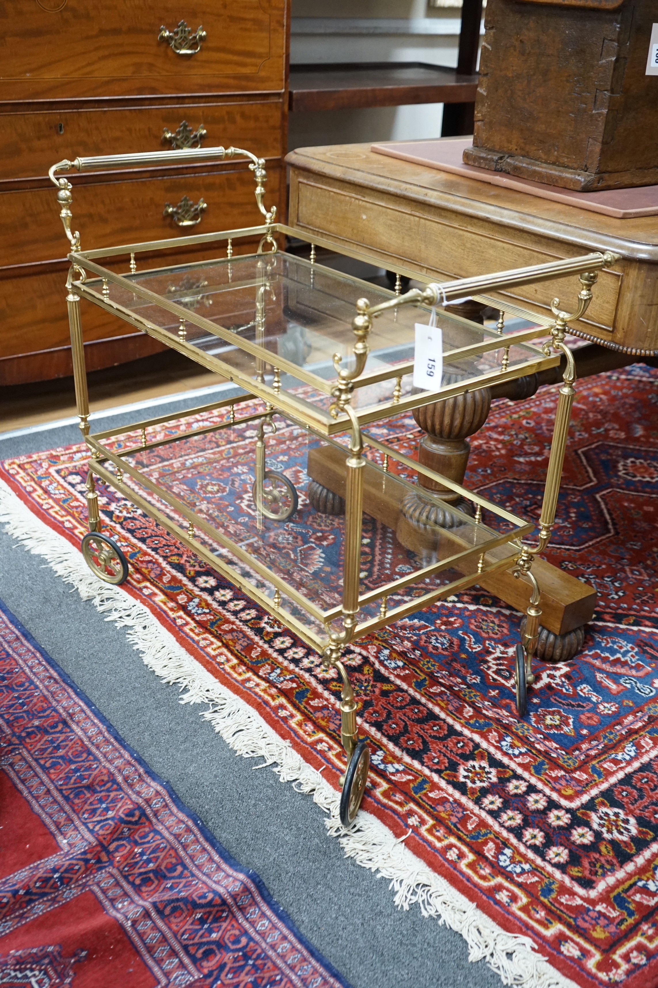 A brass and glass two tier tea trolley, width 84cm, depth 42cm, height 73cm